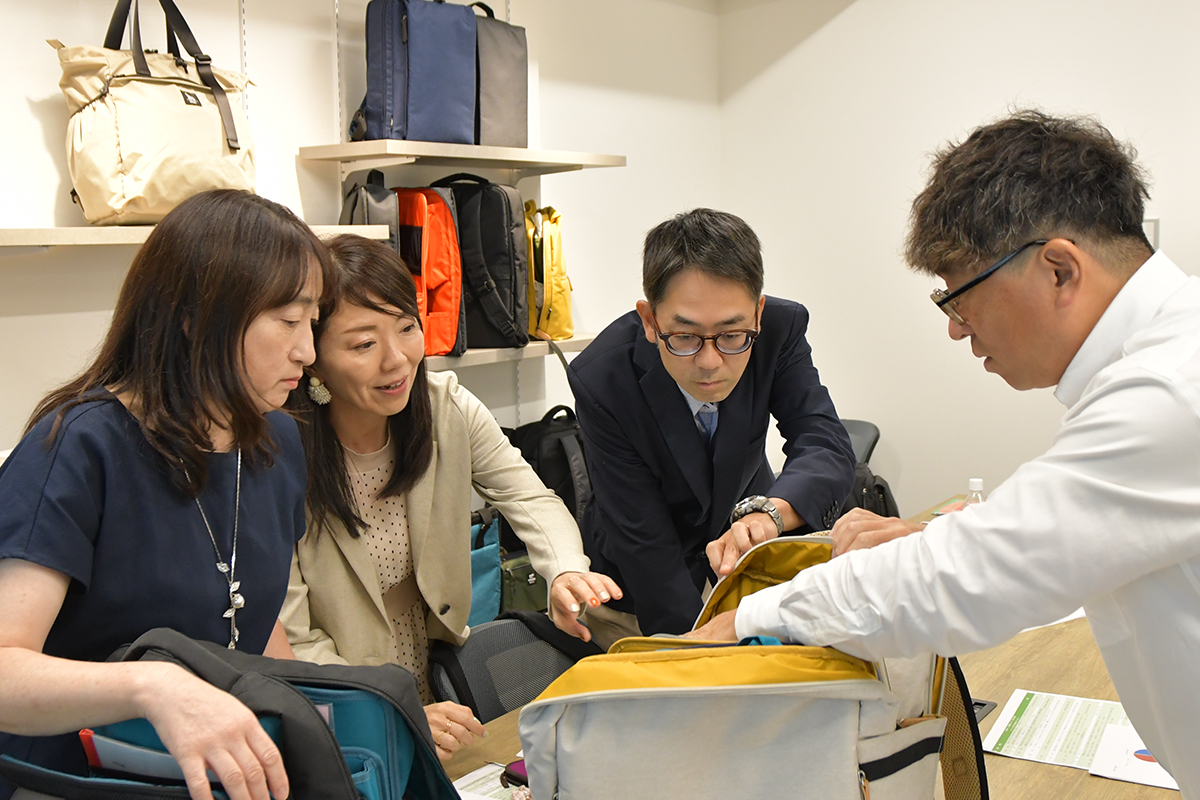 Reviewing the KABAG backpack interior structure during product development.